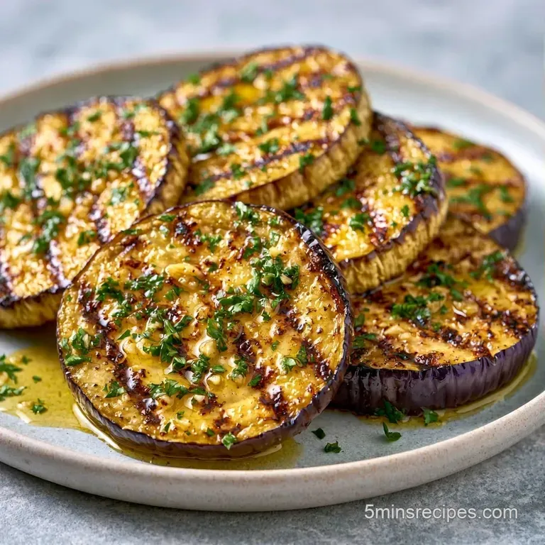 Neatly stacked grilled eggplant rounds with creamy swirls and microgreens on a matte black slate platter.