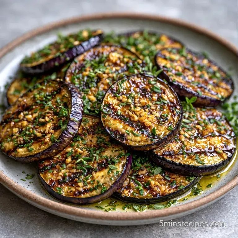 Sliced charred vegetables on a white plate, garnished with bright green parsley and fresh yellow lemon wedges.